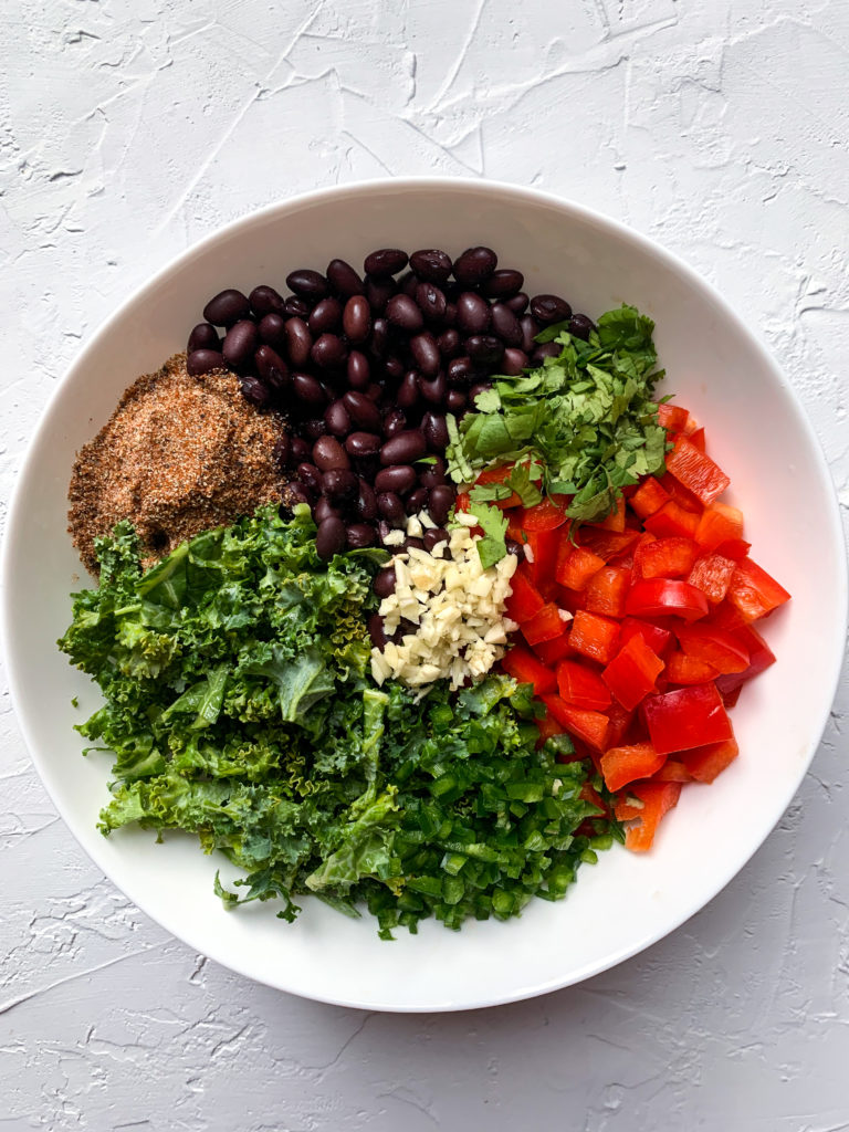 black bean and kale quesadilla filling components arranged in a white bowl