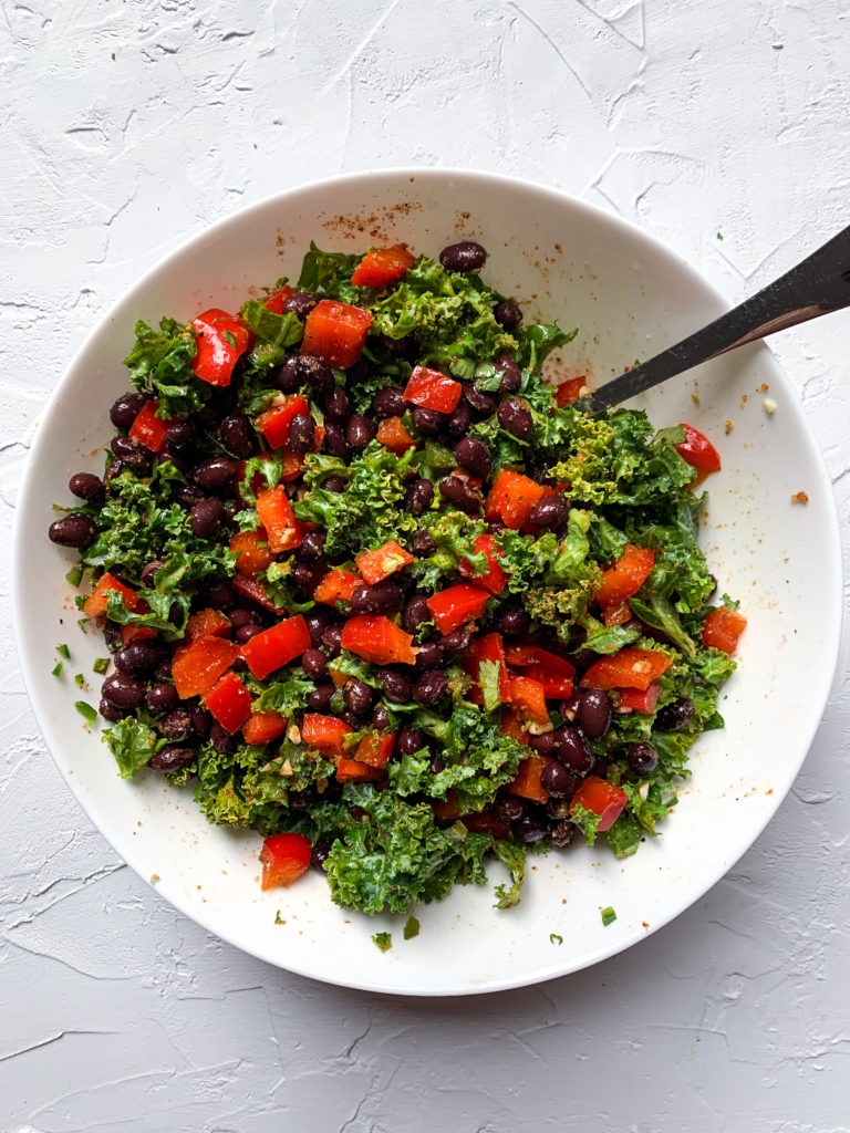 black bean and kale quesadilla filling mixed in a white bowl