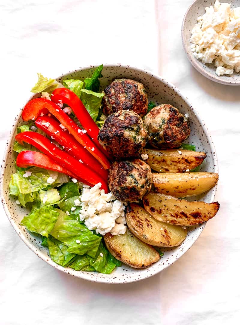 Greek Pork Meatball Bowls with Roasted Lemon Potatoes