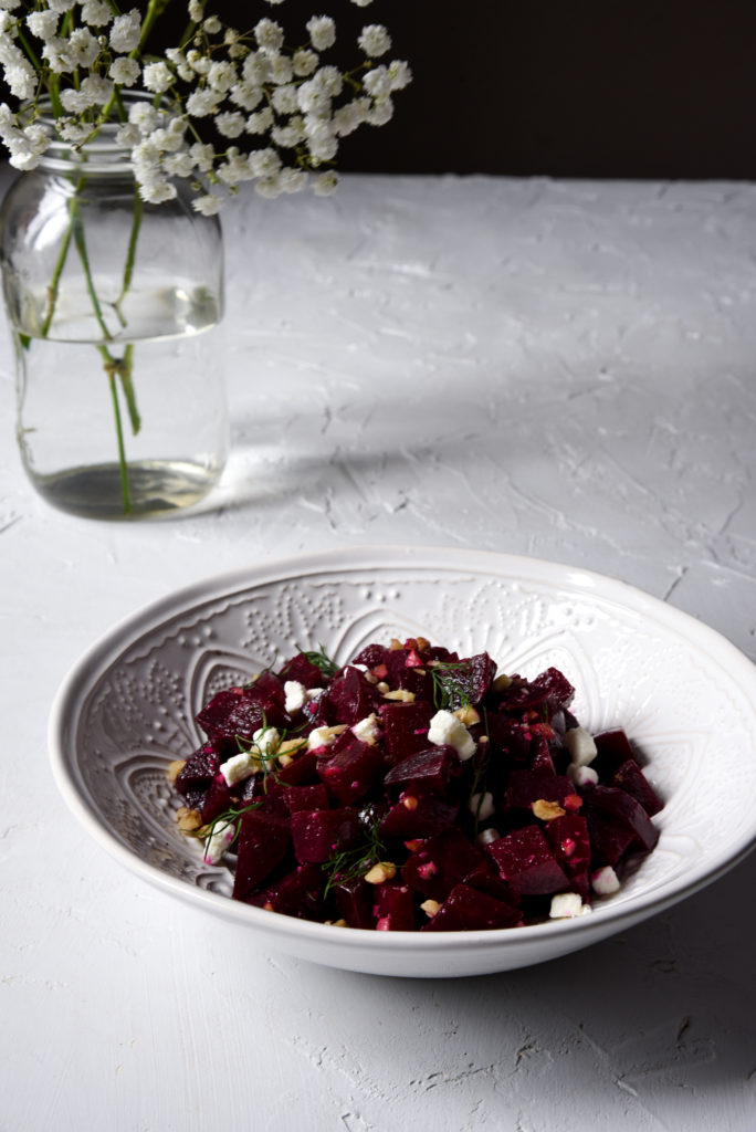 summer beet salad with simple citrus dressing in a white bowl