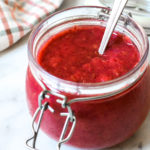 strawberry rhubarb chia jam in a jar with a spoon